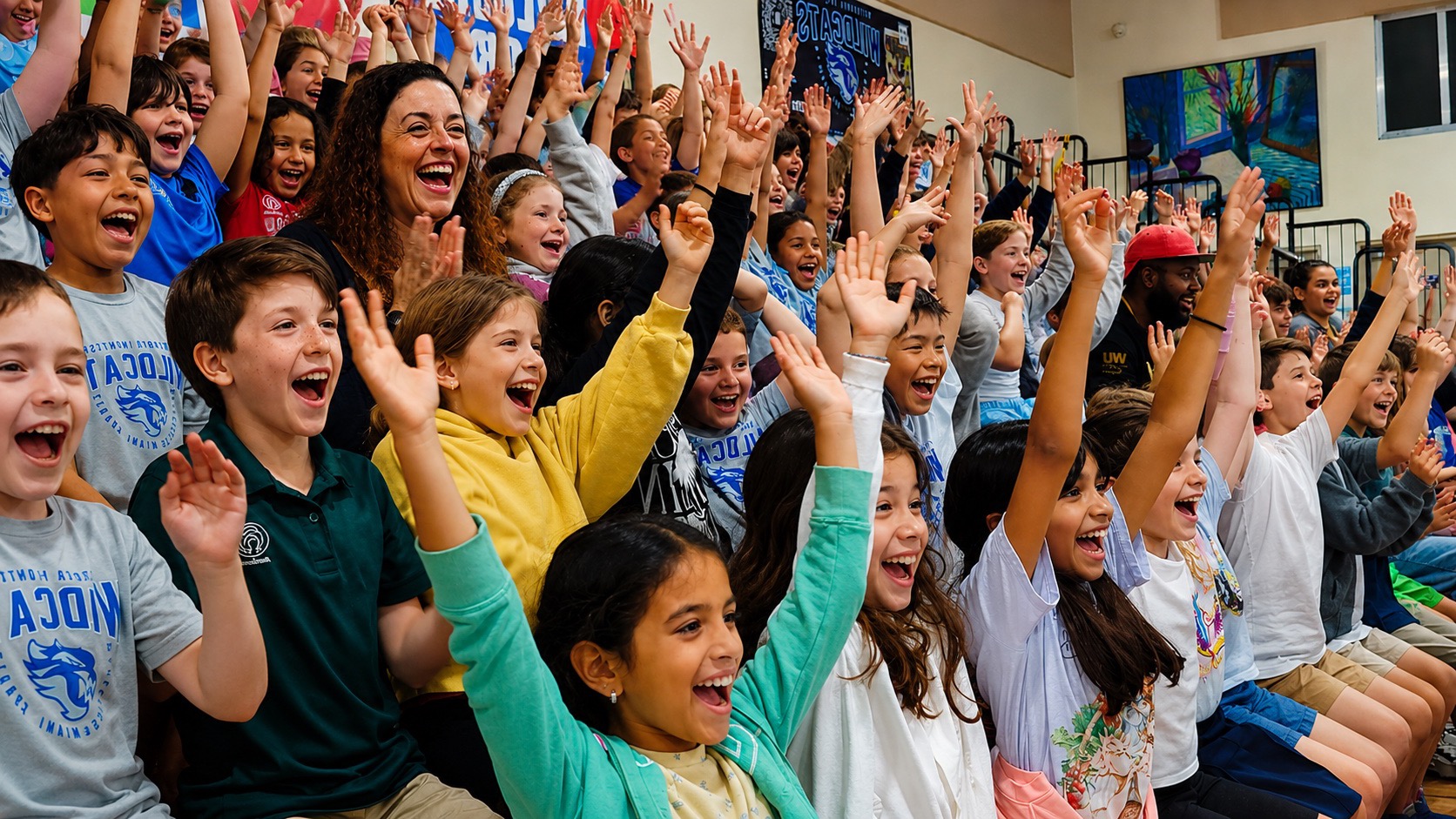 Wresh Workshop students raising their hands during a class